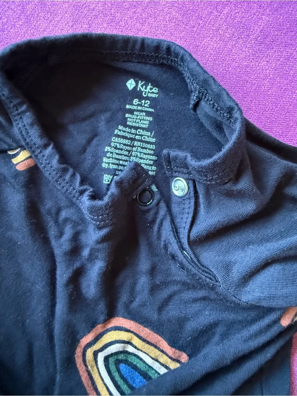 Kyte BABY Black One-Piece with Rainbow Motifs